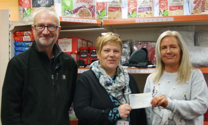 CTG Ltd Employee Ownership Trust Directors hand over cheque to Redcar food bank